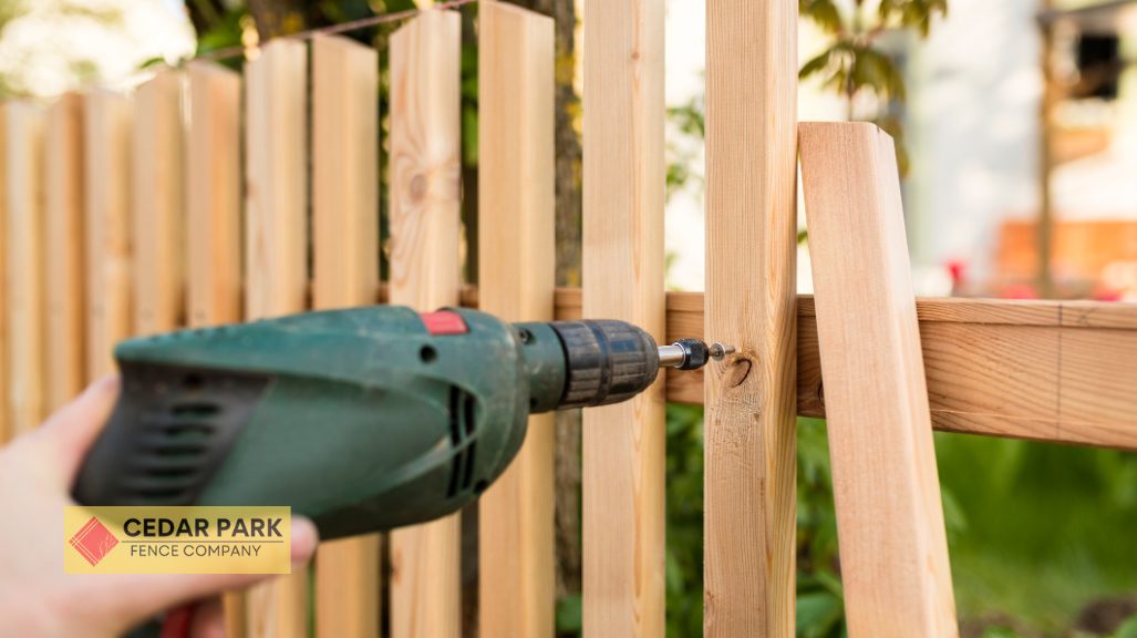 person drilling wooden plank 